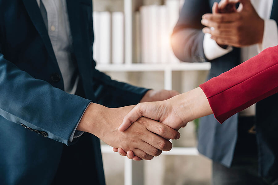 Two people shaking hands together