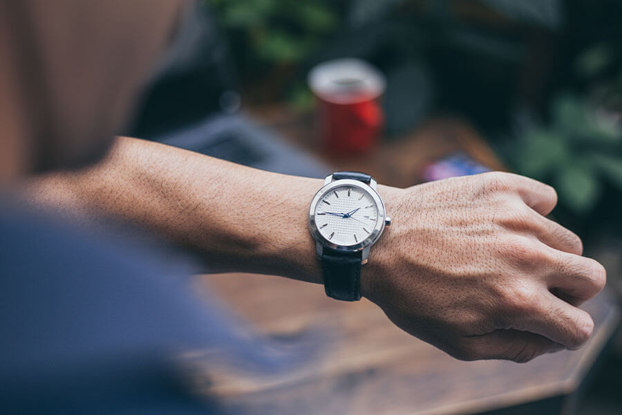 A person's wrist wearing watch.