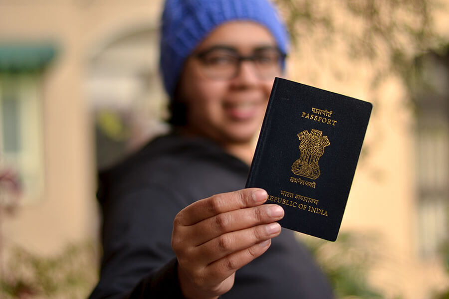 A person holding up passport