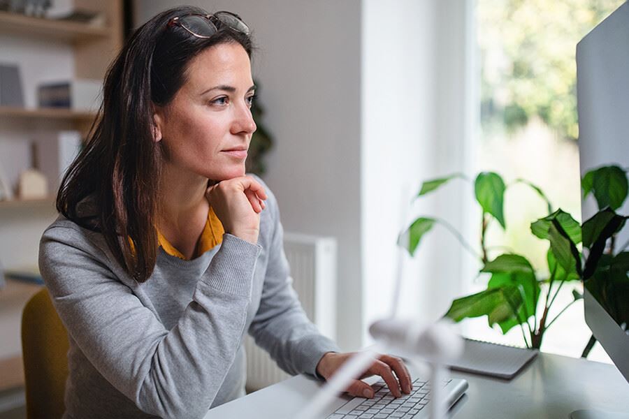 Woman looking at laptop