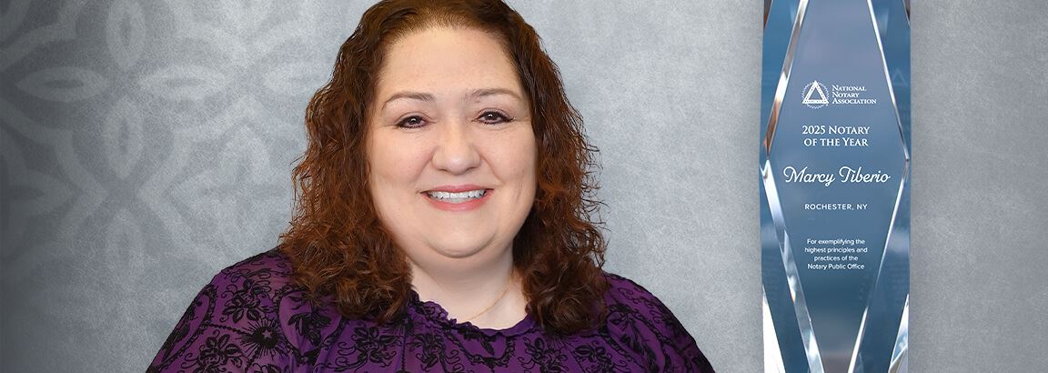 2025 Notary of the year, Marcy Tiberio with a crystal award.