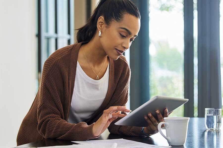 A person looking at a tablet screen