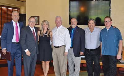 Valerie Barrett networks with members of the Orange County Stadium Club.