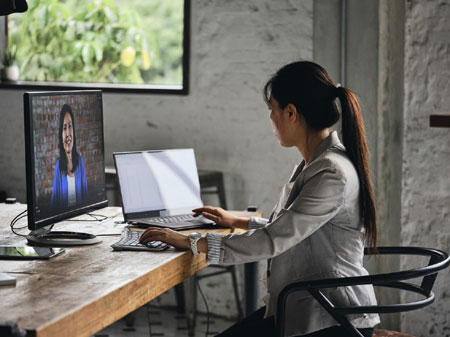 Female Notary performing remote online notarization on a computer monitor