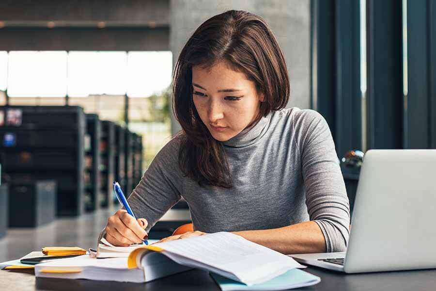 A person studying in a library.