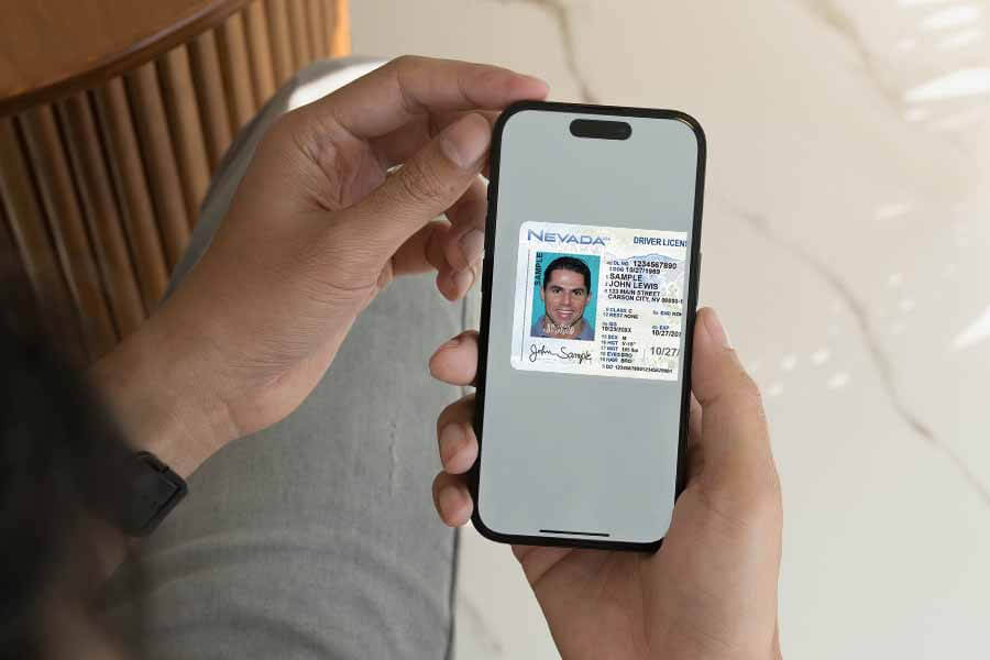 Notary examining photo of signer ID on mobile device