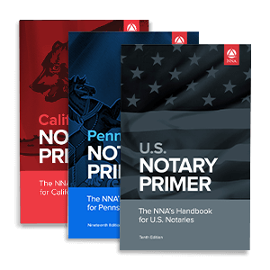 a stack of state-specific and national notary handbooks