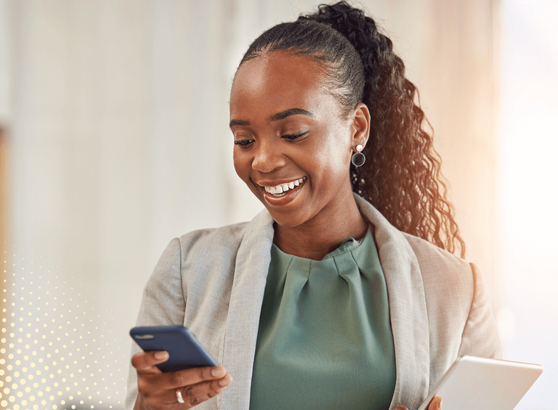 A female Signing Agent looking at her phone
