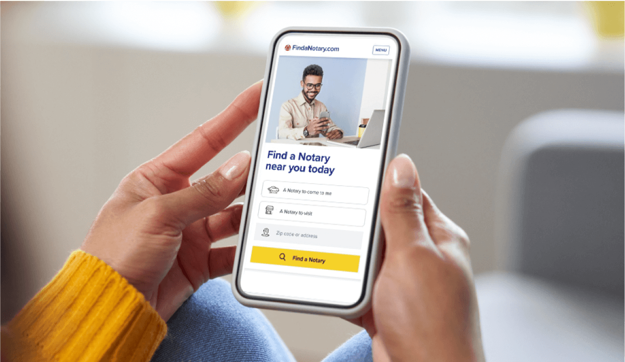 hands holding a phone displaying the Find a Notary website