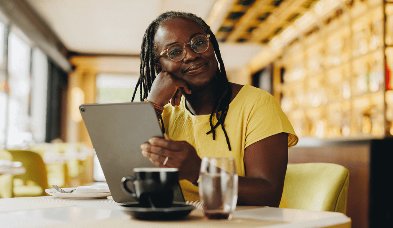 male Notary looking at a laptop and holding a toddler